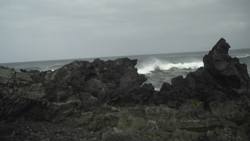 Waves crash on a rocky beach