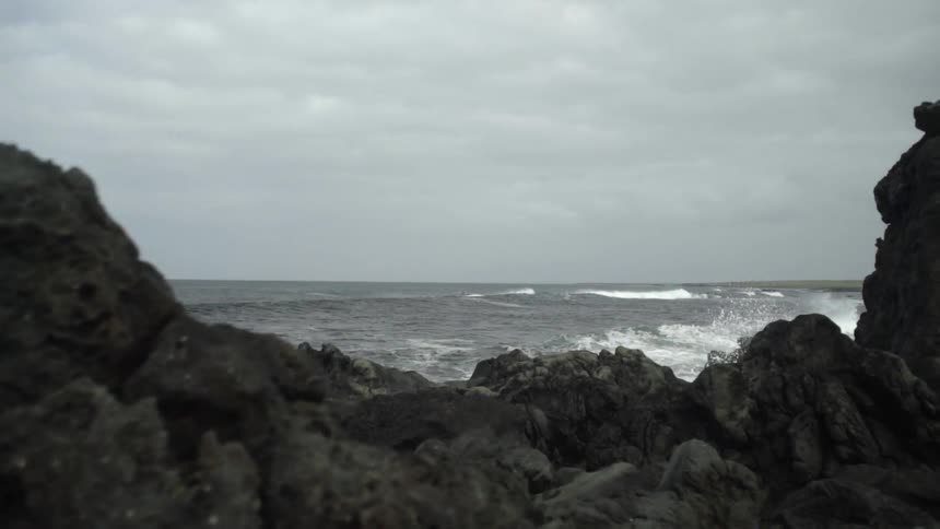 Waves crash on a rocky beach