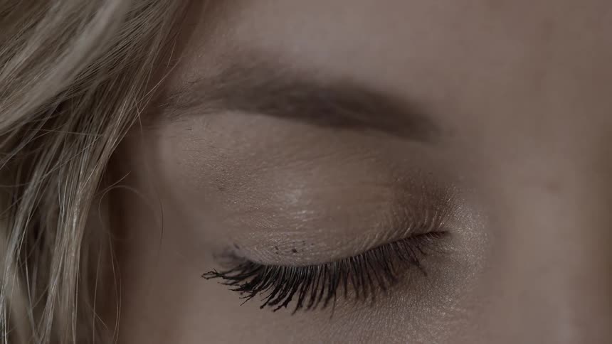 A woman opens her eye