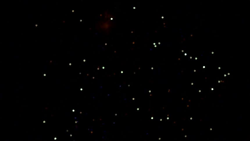 A firework explodes in the dark night sky