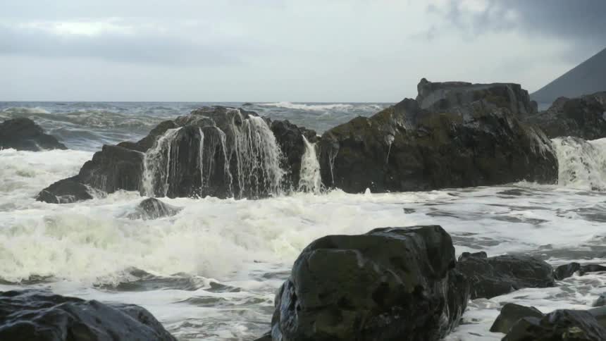 Waves crash on a rocky beach