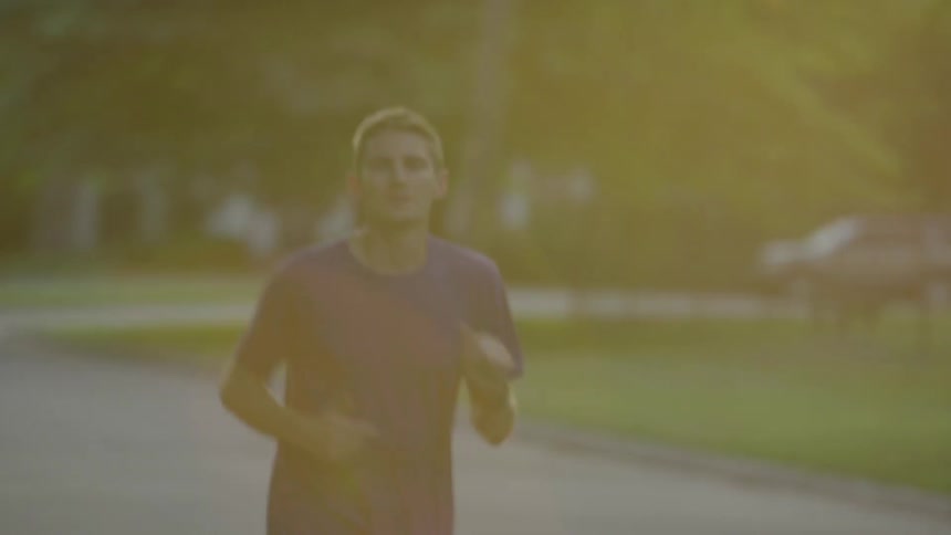 A man jogs down the street