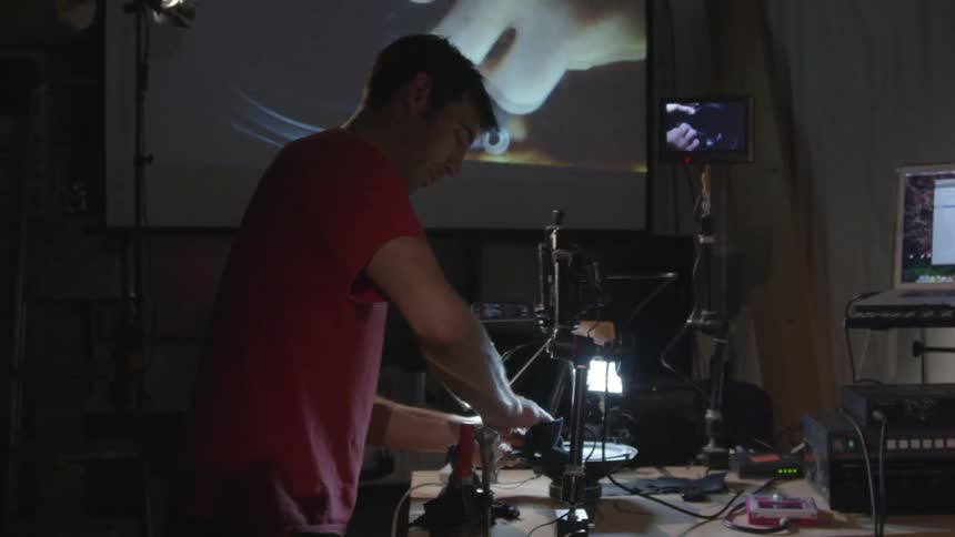 Man cleans a speaker on camera