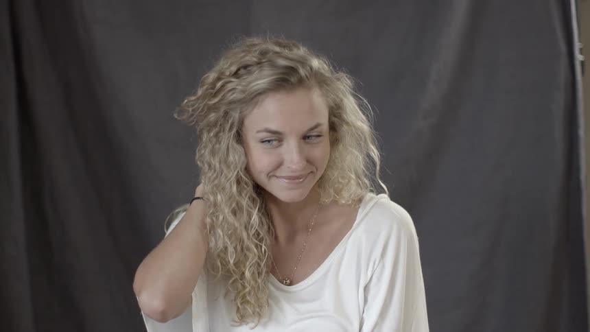A woman smiles and laughs