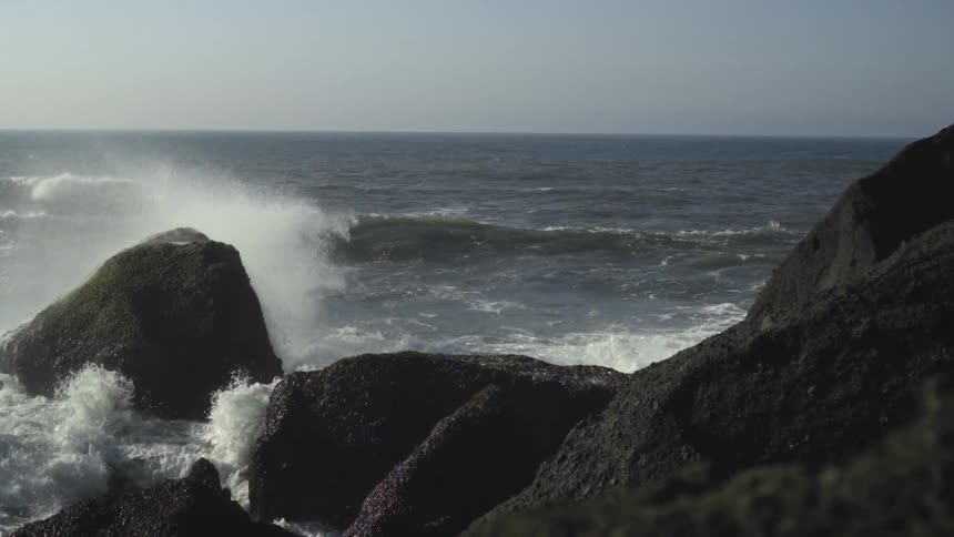 Waves crash on a rocky shore