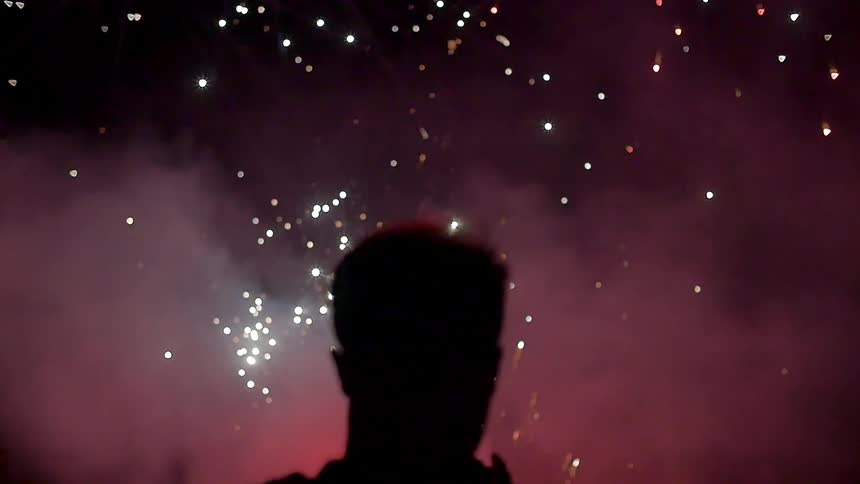 Man walking into blinking lights and smoke