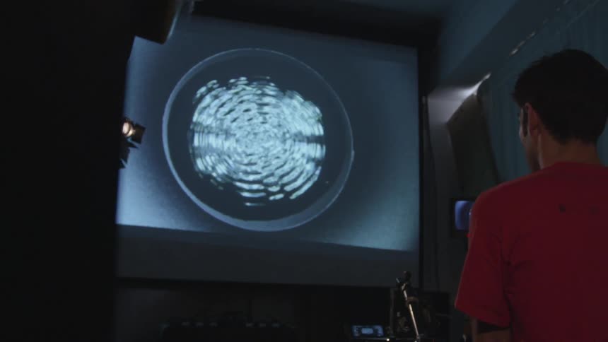 A man looking at the screen