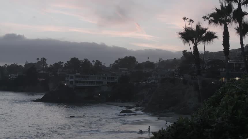 People on the beach in the early evening