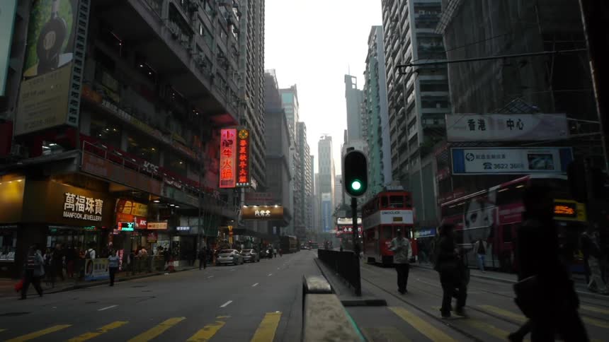 Pedestrians cross a street in an urban area