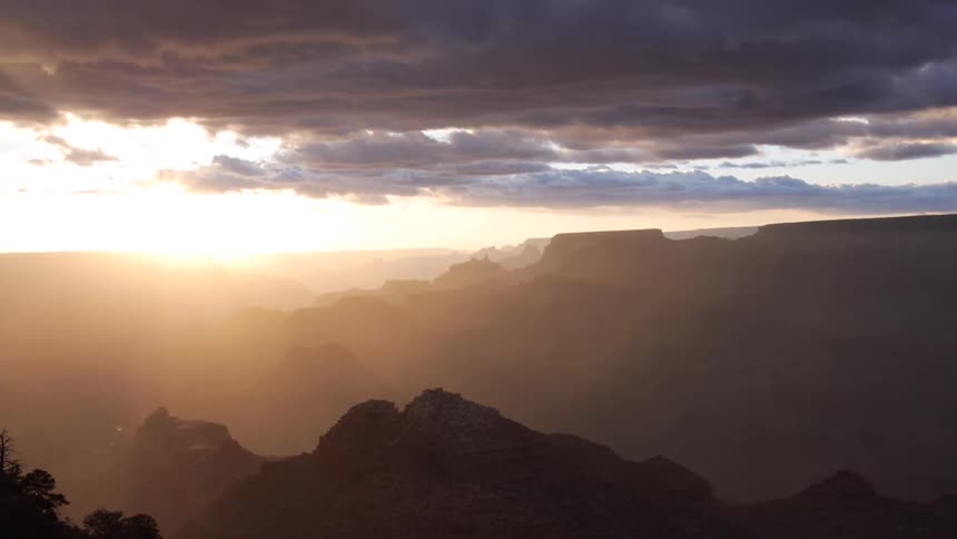 The sun sets over the mountains