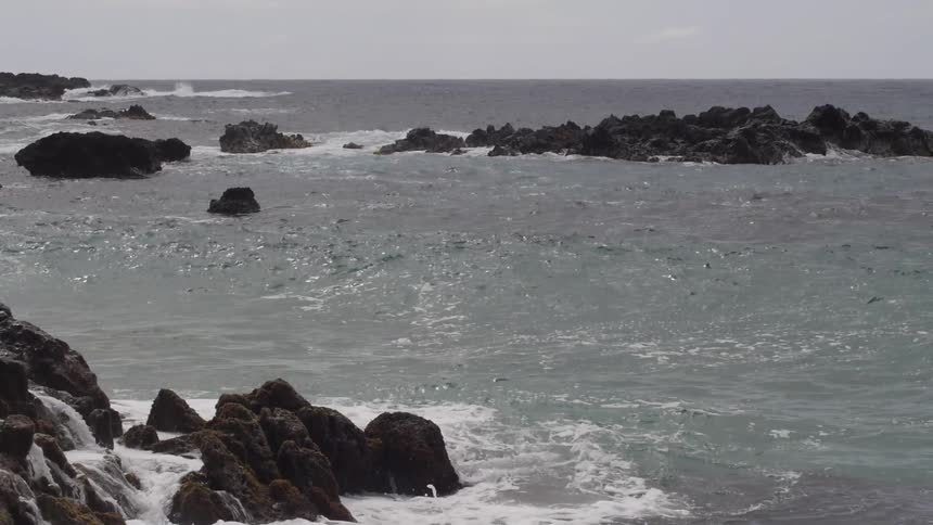 Waves crashing against rocks