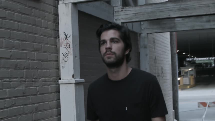 A man with black shirt walks