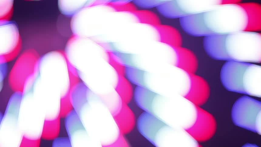 Pink and white flashing lights spiral and rotate