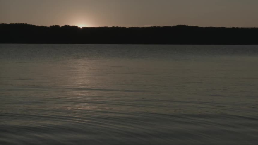 A breeze blows over a lake