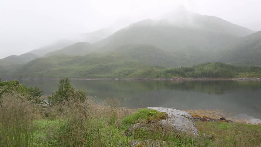 View of a mountain and lake on a cloudy day