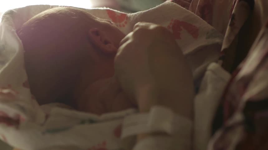 A baby is being held