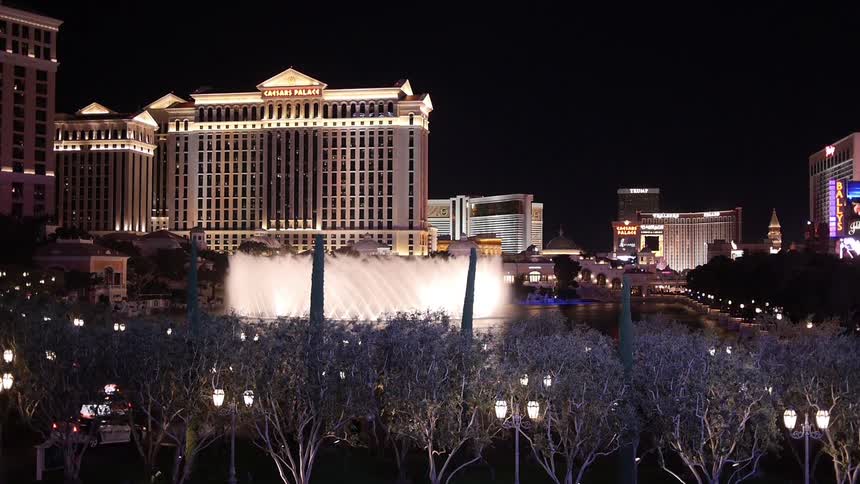 Caesars palace is shown with a fountain in the forefront
