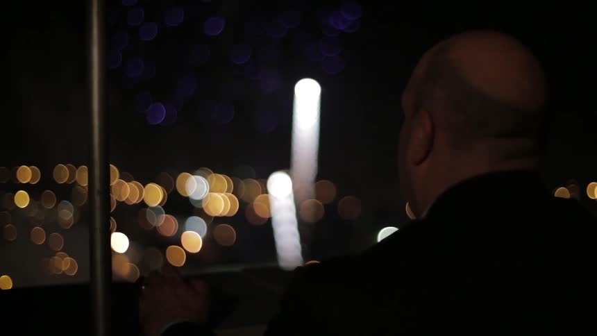 A person watching fireworks