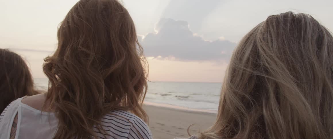 Women look out at the ocean