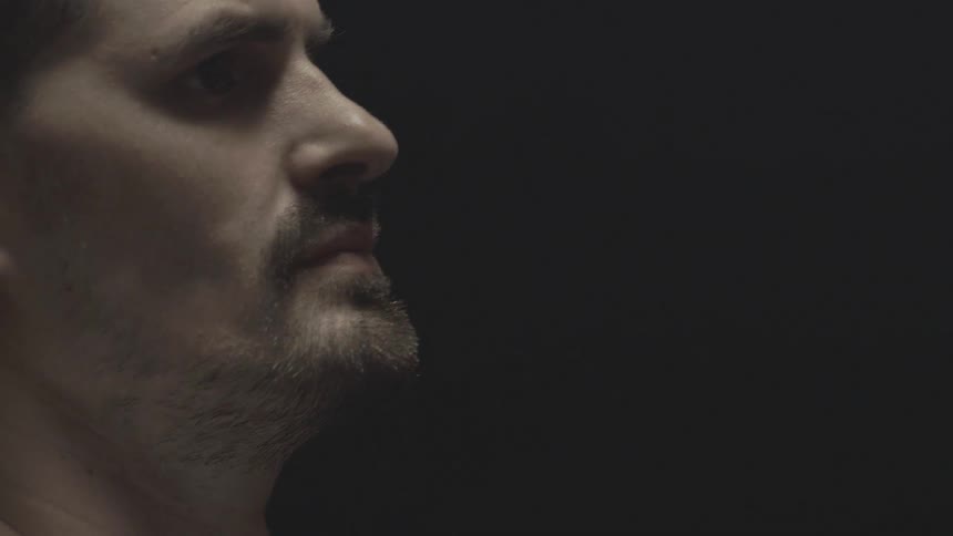 A portrait of a man face in the dark