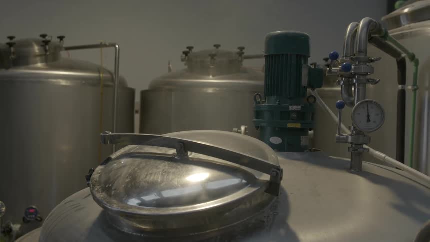 Room with many large fermenter containers