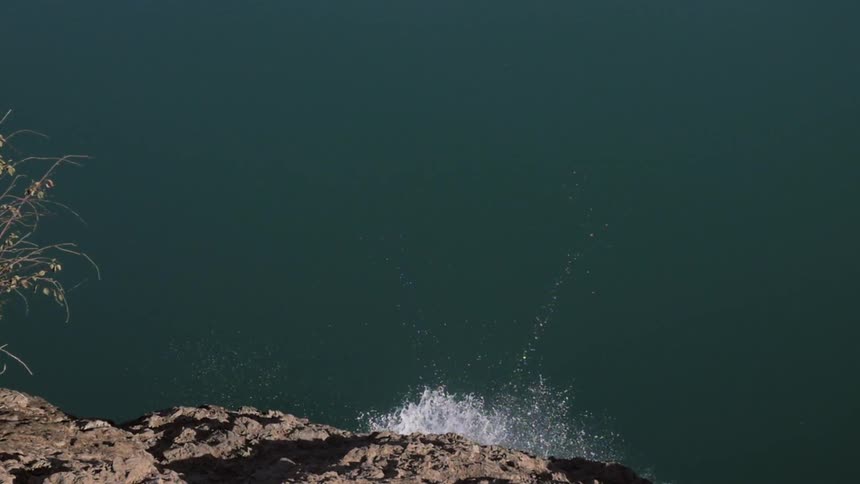 A person jumping off of a cliff