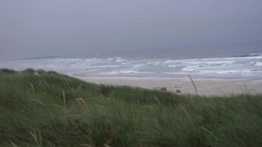 Waves wash up onto a sandy beach