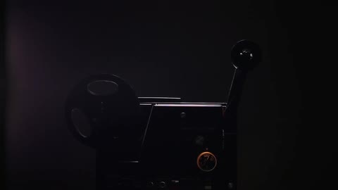 A reel spinning and coming off of a movie projector