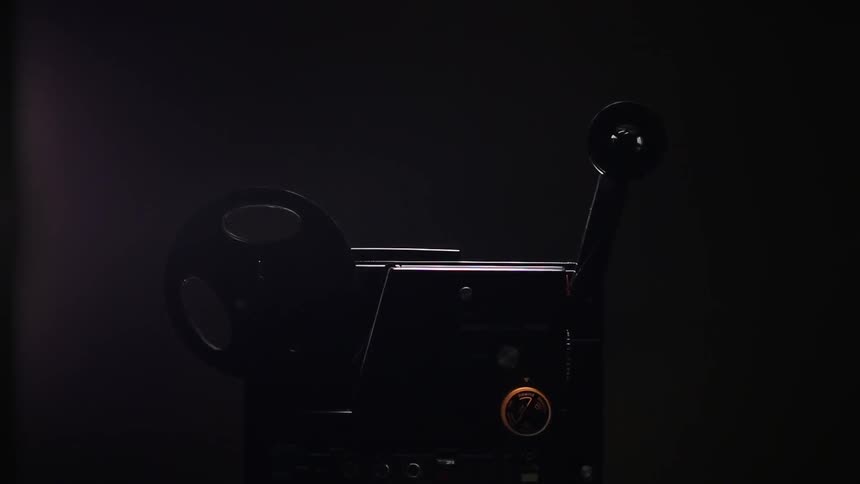A reel spinning and coming off of a movie projector