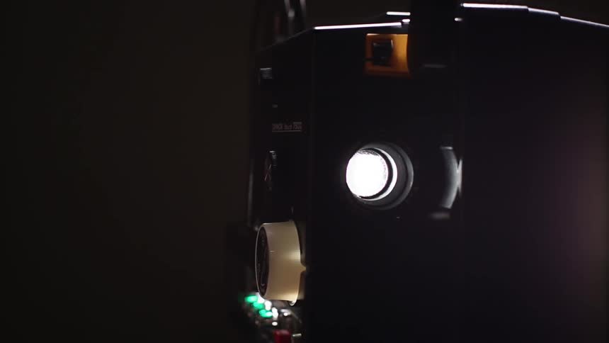 A film canister spinning on a reel