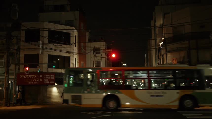 Busy downtown city street at night