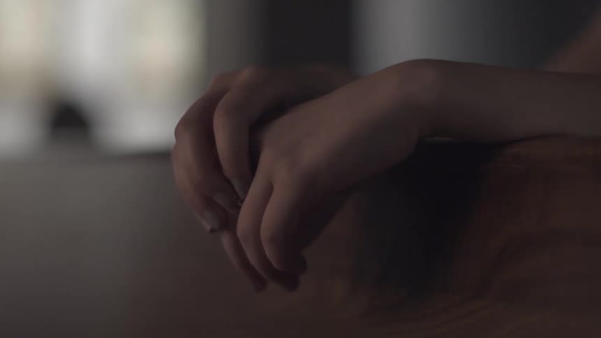 Close up of a person fidgeting with their fingers