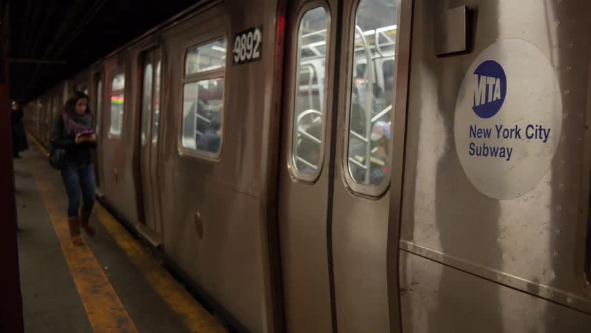 Subway car pulling into a station