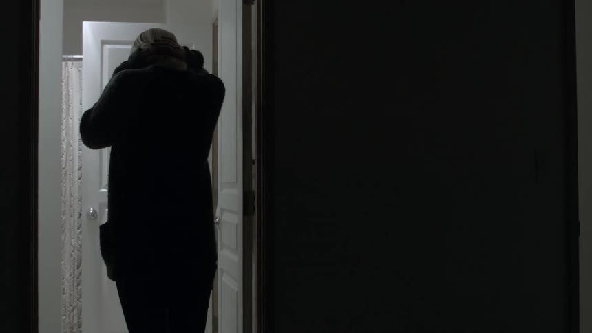 A person walking into a restroom
