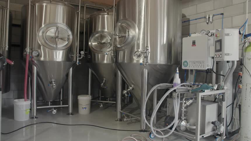 A room containing machinery and fermenters