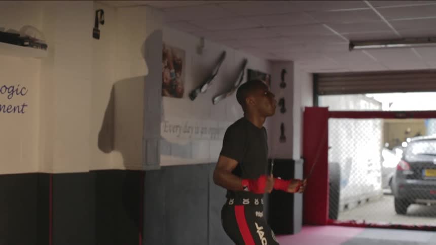 A person jumping rope in a gym