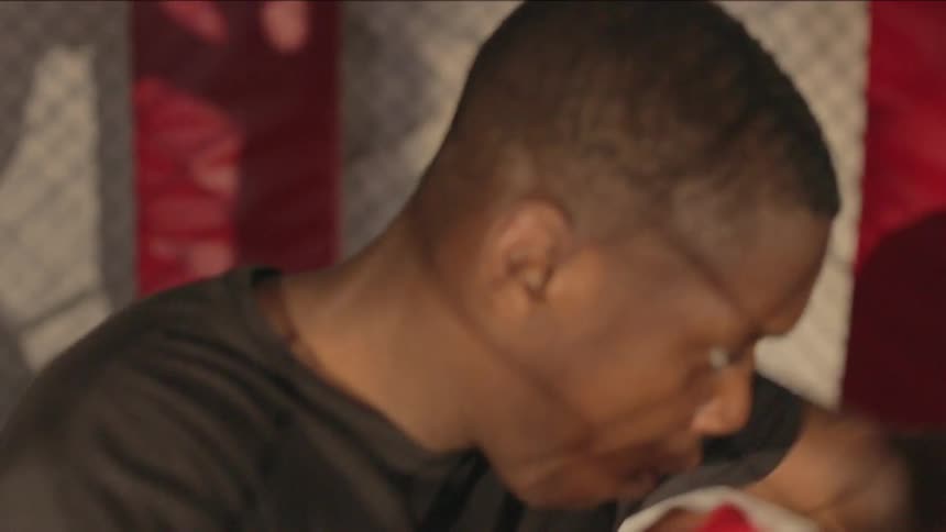 Black man practicing boxing punches