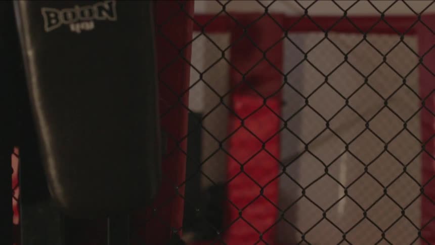 Black man practicing boxing punches in a ring
