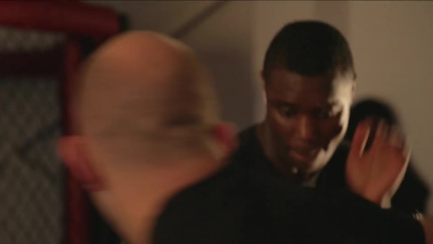 Two men in a practice boxing match