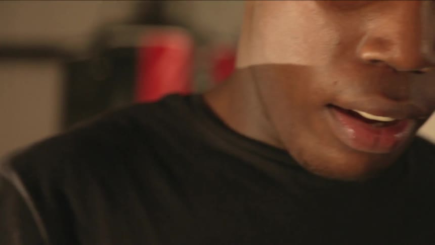 A man puts a mouthguard into his mouth