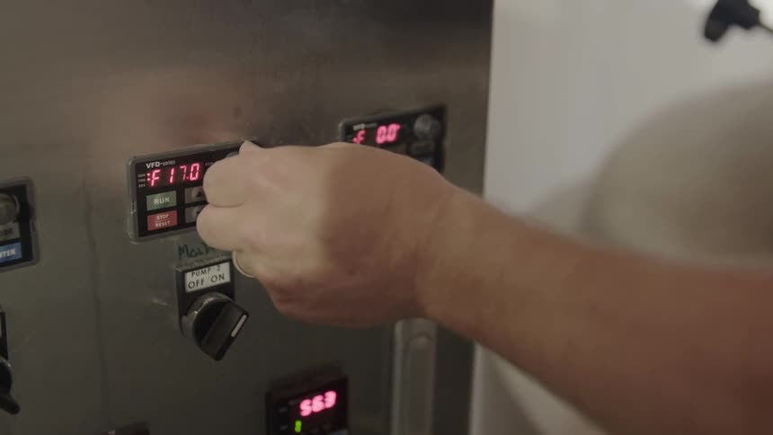 A person messing with some dials