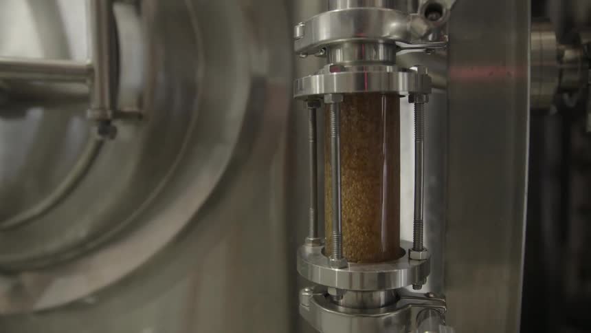 A machine mixes the golden product