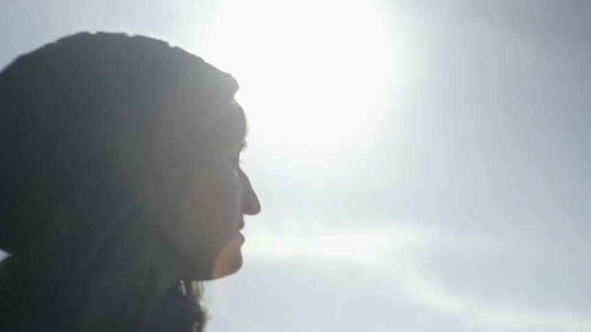 The sun shines down on a hiker
