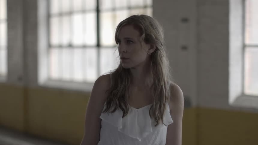 A woman in a white blouse