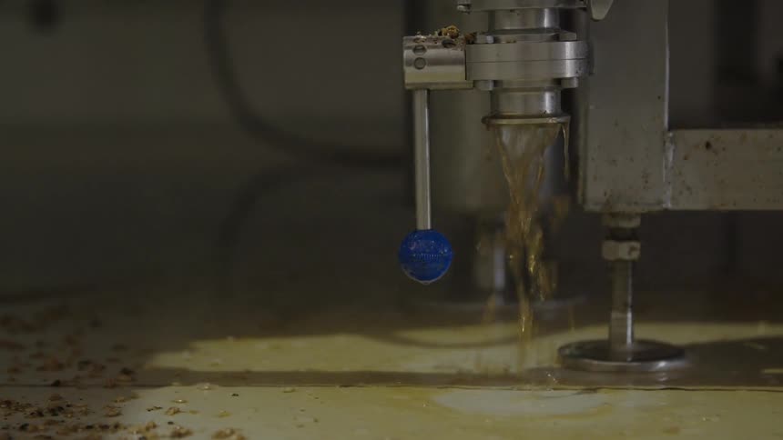Hot liquid gushes from a machine