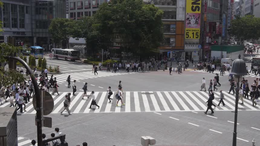 Crowd of people walking on a city square Shibuya Tokyo