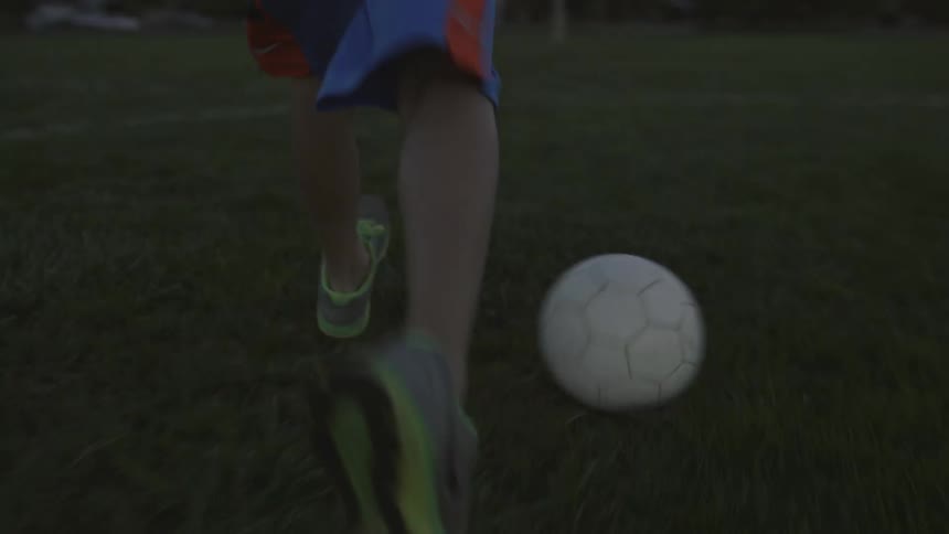 A child is playing with his ball