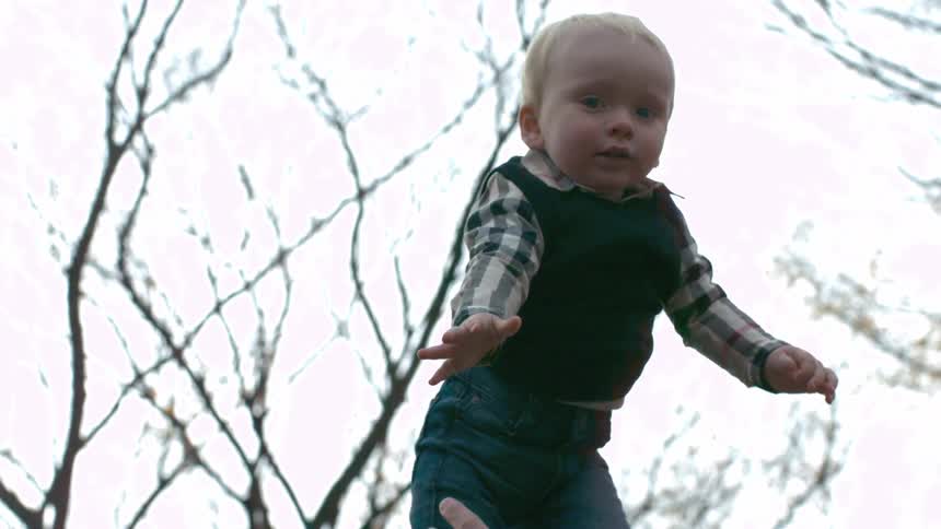 A child is flung into the air while playing