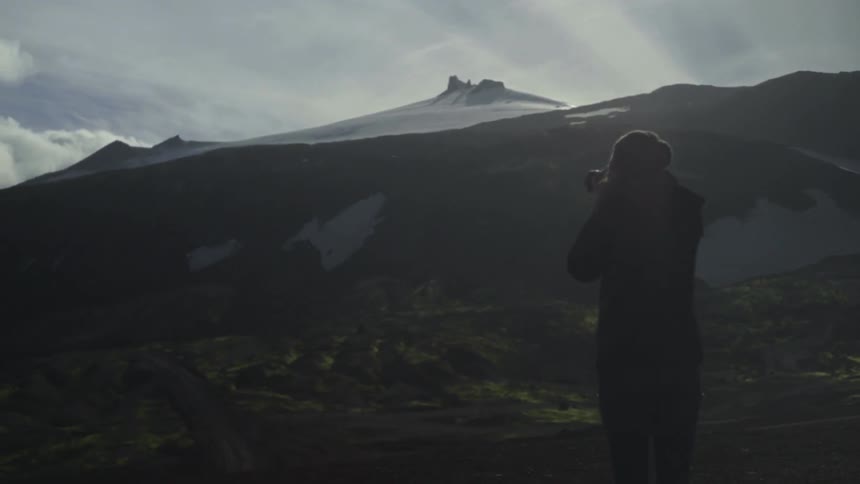 A person taking pictures of nature