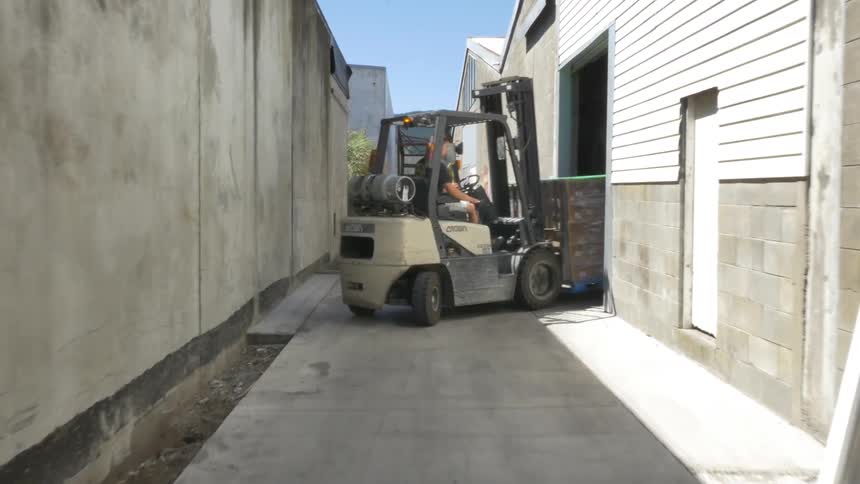 A forklift driving by